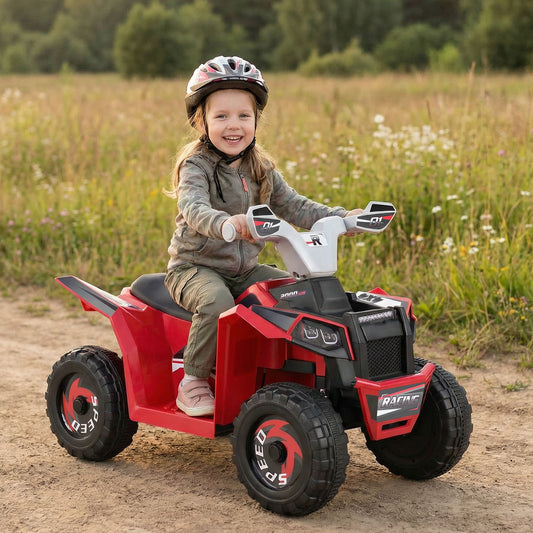 A young girl wearing a helmet rides the red kids electric quad in a field