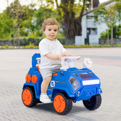 A toddler sits in the navy blue kids electric car on a paved surface