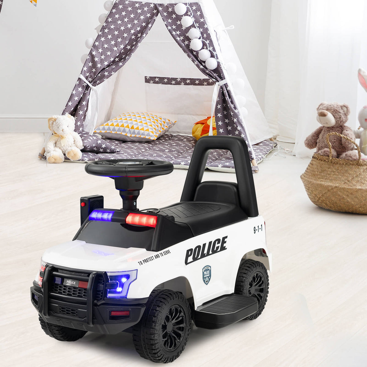 The kids electric police car is parked in a child's bedroom next to a teepee tent