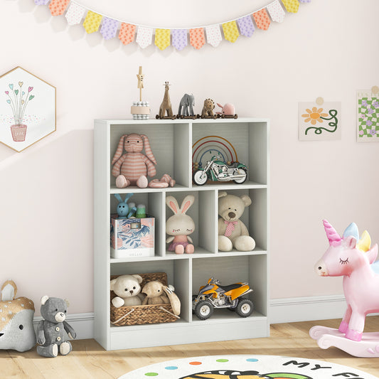 White kids storage unit with toys and books in a child's room