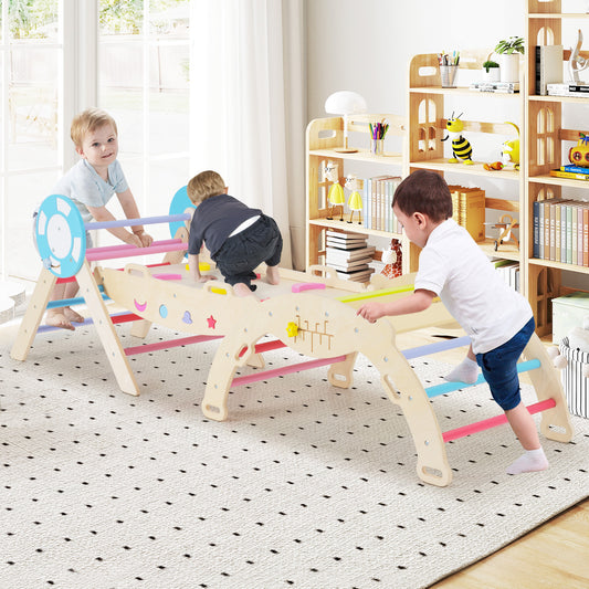Three toddlers playing on the wooden climbing frame in a bright room with a patterned rug