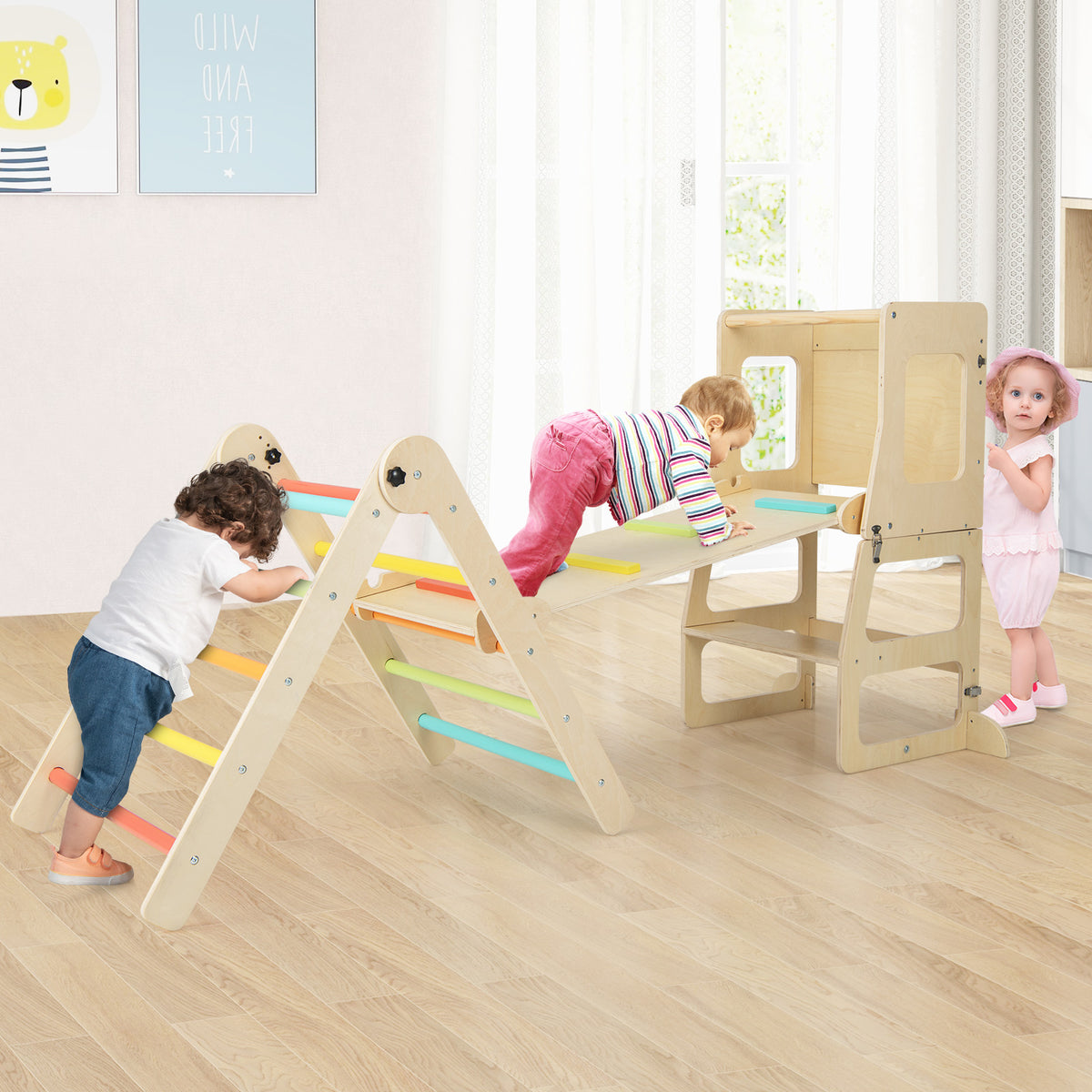 Children playing on the colourful wooden climbing frame with a slide and a step stool