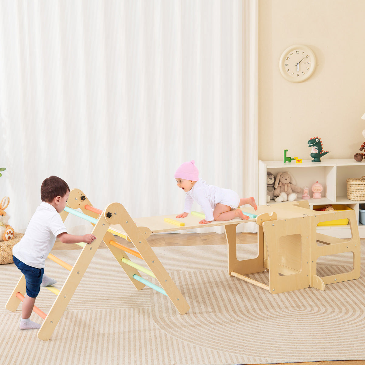 Toddlers climbing and sliding on the colourful wooden play set indoors