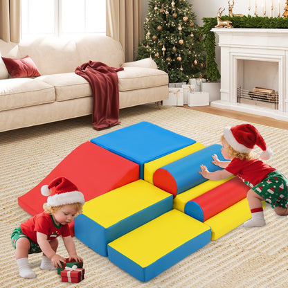 Two babies playing on the soft play sets in a festive living room