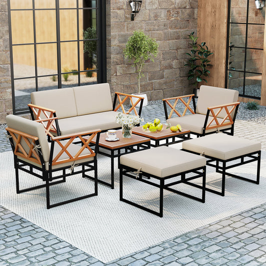 7 Piece Outdoor Conversation Set with Ottomans for Porch, the patio furniture set arranged on a rug on a stone patio outside