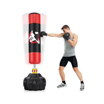 70 Inches Freestanding Punching Bag with Fillable Base in red and black with a person punching it