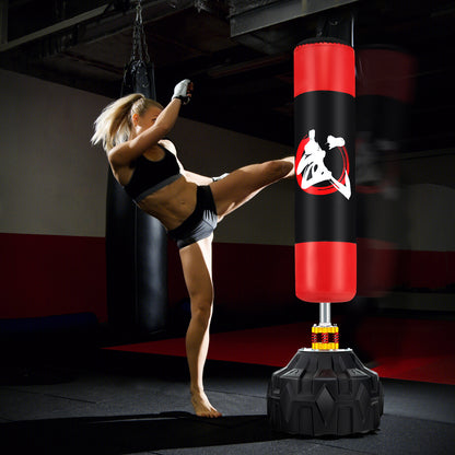 The freestanding punching bag being used by a woman in a gym