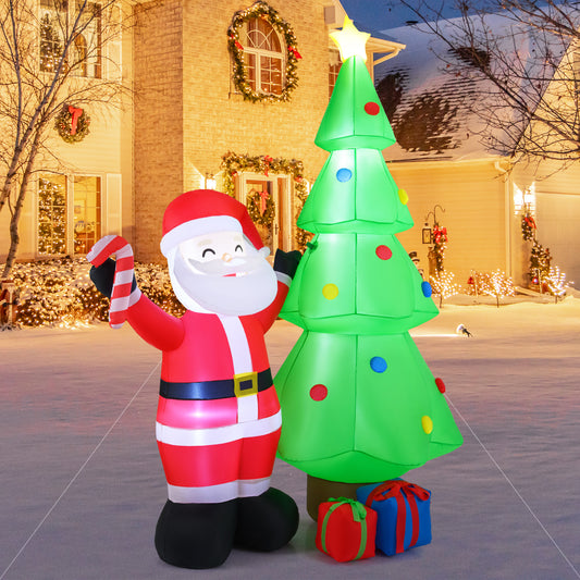 The Christmas inflatable decoration set up outside a house at night, with Santa and a tree illuminated against the dark sky