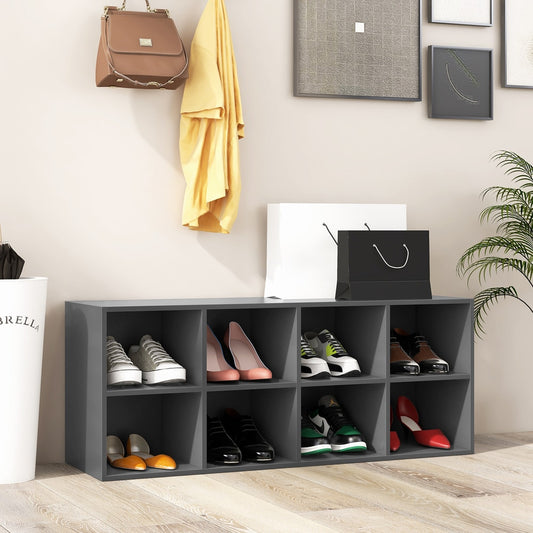 The shoe rack with eight cubbies filled with various shoes and a handbag on top