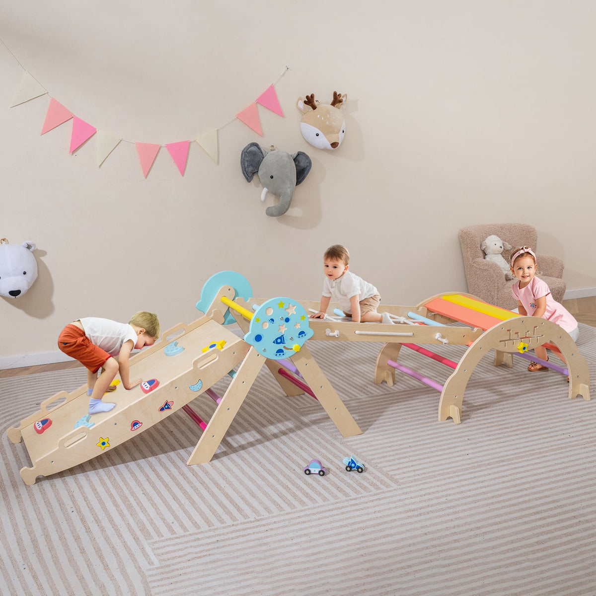 Toddlers playing on the colourful climbing frame in a bright room