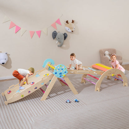 Toddlers playing on the colourful climbing frame in a bright room