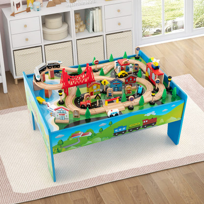 The wooden activity playset with a train set, shown in a child's room