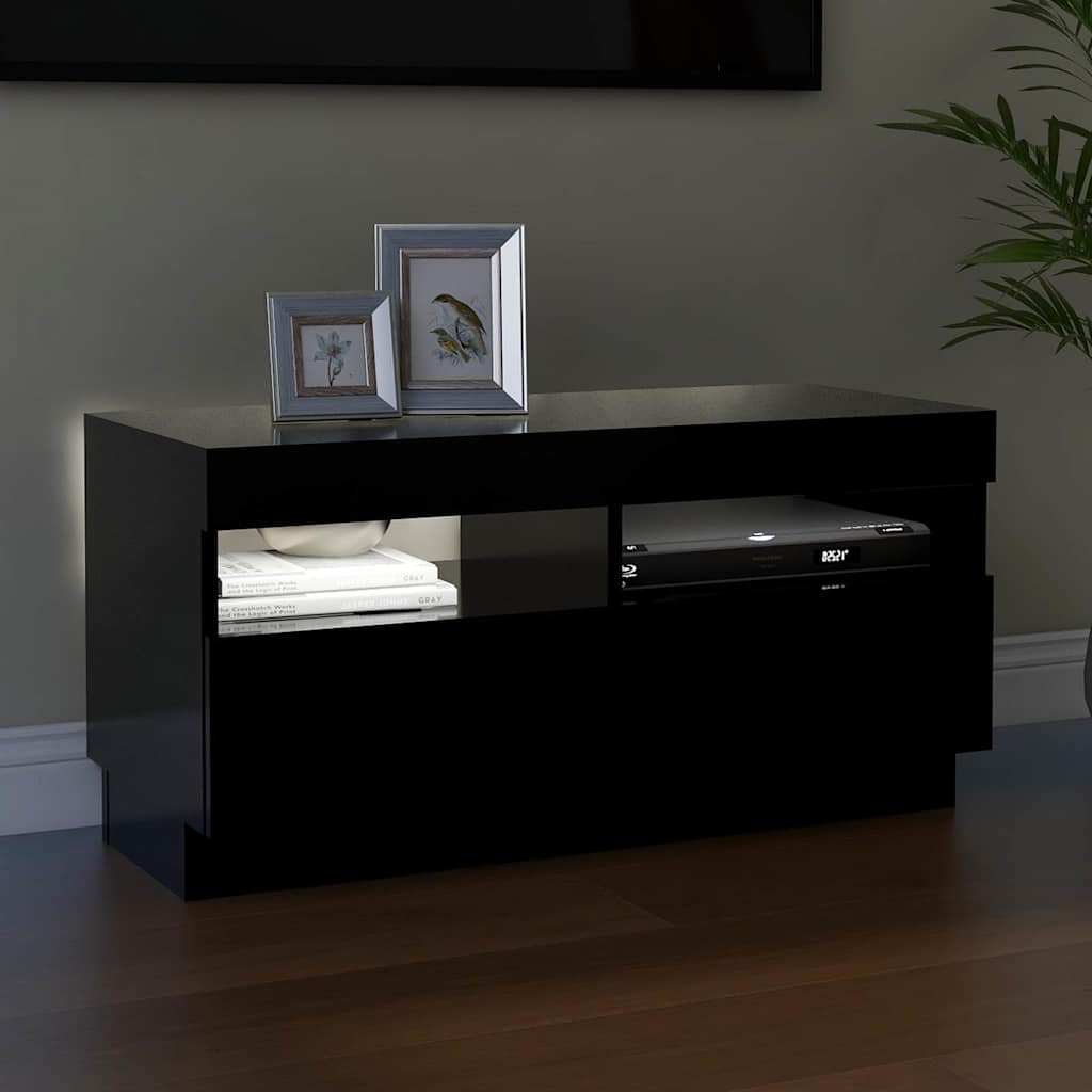 The TV cabinet with its internal lights off, showing the shelves and compartments