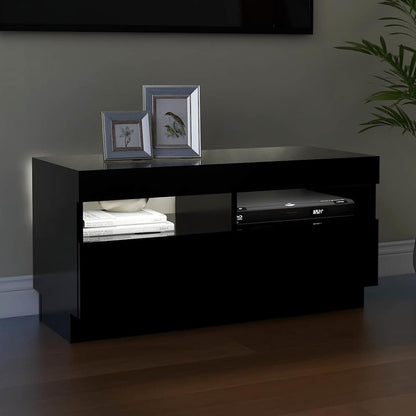 The TV cabinet with its internal lights off, showing the shelves and compartments