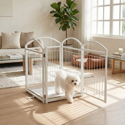 The white pet gate is set up in a living room with a bichon frise walking through the open door