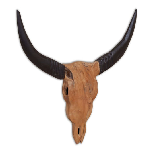 The wooden bull skull sculpture, showing the natural wood grain of the skull and the dark horns