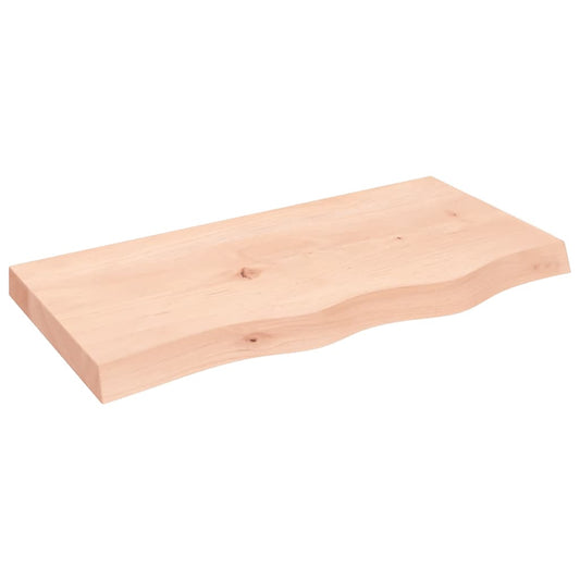 Untreated solid wood oak table top with a natural live edge on a white background