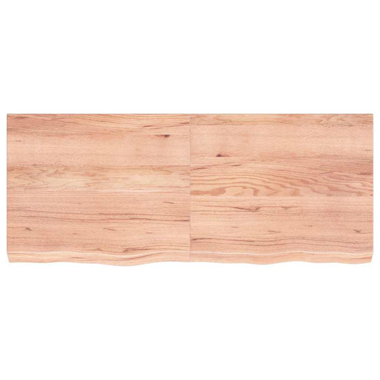 Close-up of the light brown oak wood grain on the table top