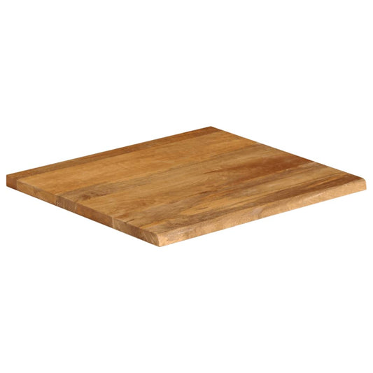 The solid wood mango table top with a live edge, shown from a high angle
