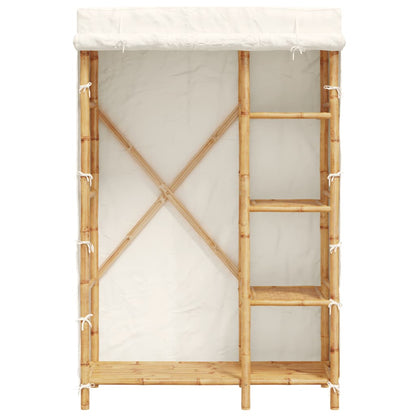 The bamboo wardrobe with shelves and a hanging rail visible behind the open cover