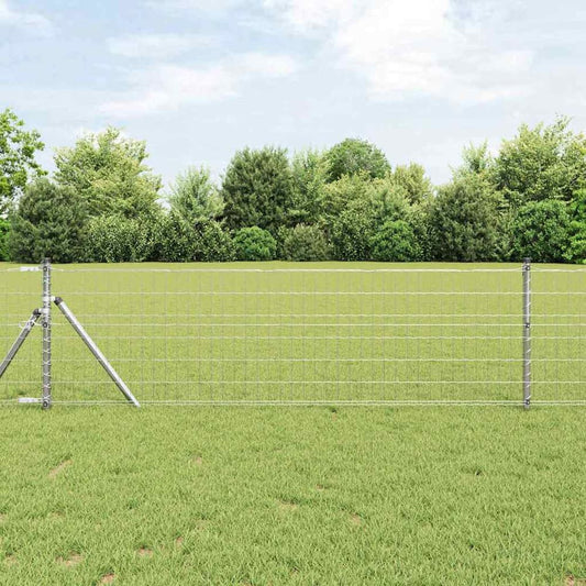 vidaXL Outdoor Euro Fence Ground Fix Galvanised Steel Mesh installed in a grassy field with trees in the background