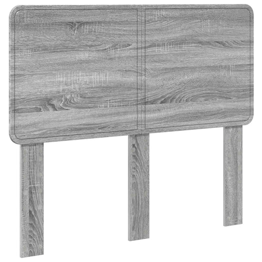 The grey headboard with two support legs shown from the front