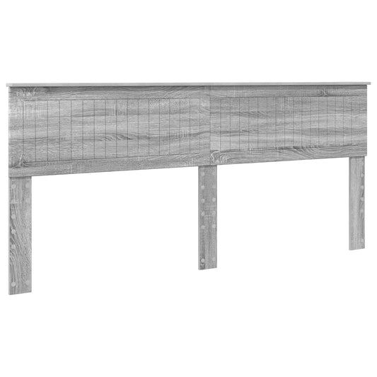 The grey Sonoma engineered wood headboard standing alone