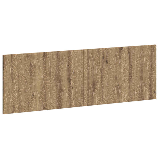 The wall-mounted headboard with a repeating leaf pattern
