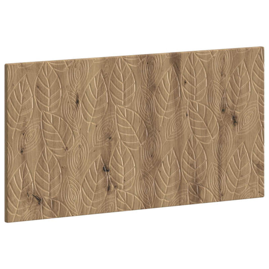 Close-up of the carved leaf pattern on the artisan oak engineered wood headboard