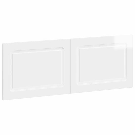 The wall-mounted headboard shown from a high angle to display the glossy white finish