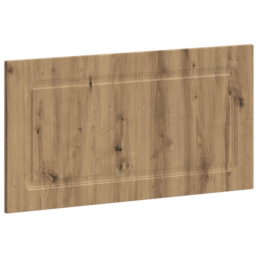 Close-up of the wood grain and decorative panel on the wall-mounted headboard