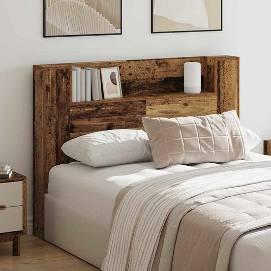 vidaXL Storage Headboard with LED Old Wood Engineered Wood placed behind a bed in a bedroom