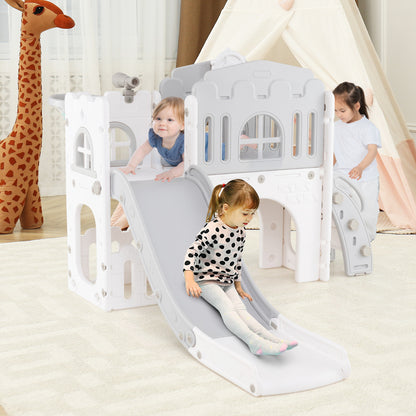 Three toddlers enjoy playing on the grey and white kids slide and climber playset indoors