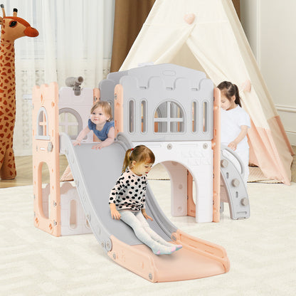 The kids slide being used by two children in a bedroom with a teepee tent and giraffe toy