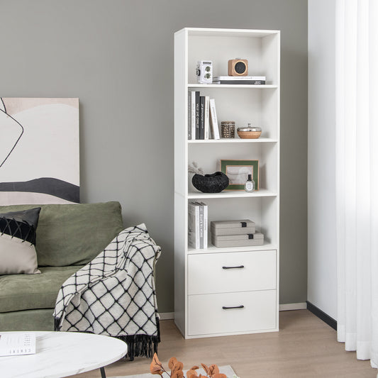 The bookcase placed in a living room next to a sofa with decor on the shelves