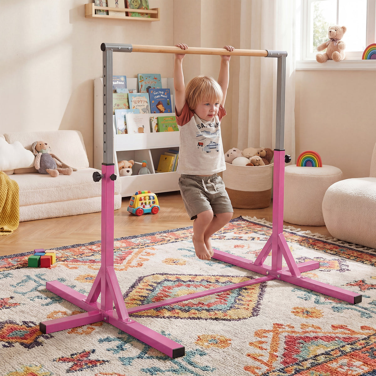 The yoga accessory set up in a child's bedroom with a boy hanging from the horizontal bar