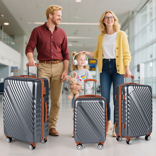 Family with three grey suitcases in an airport terminal