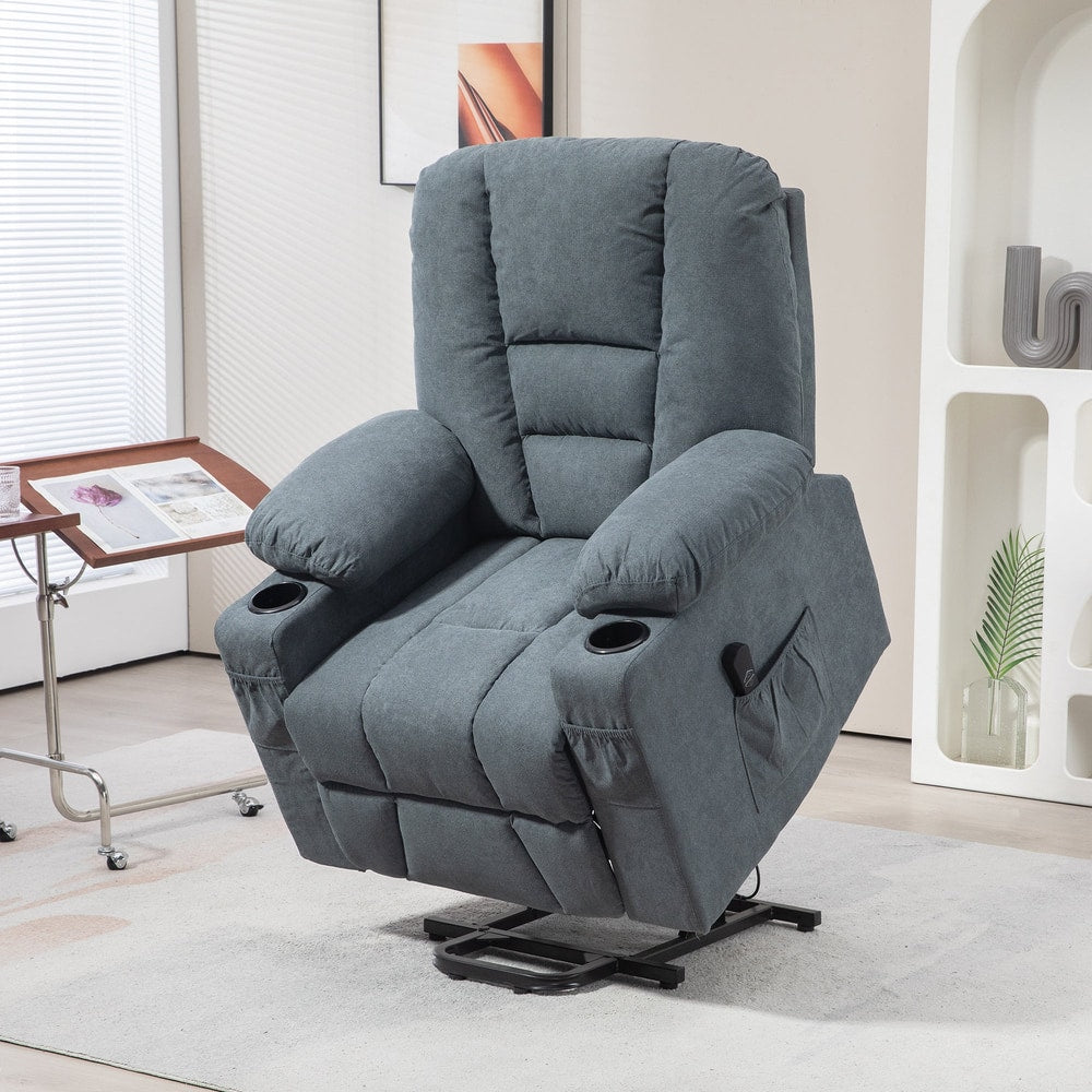 The grey fabric riser and recliner chair is shown in a living room setting