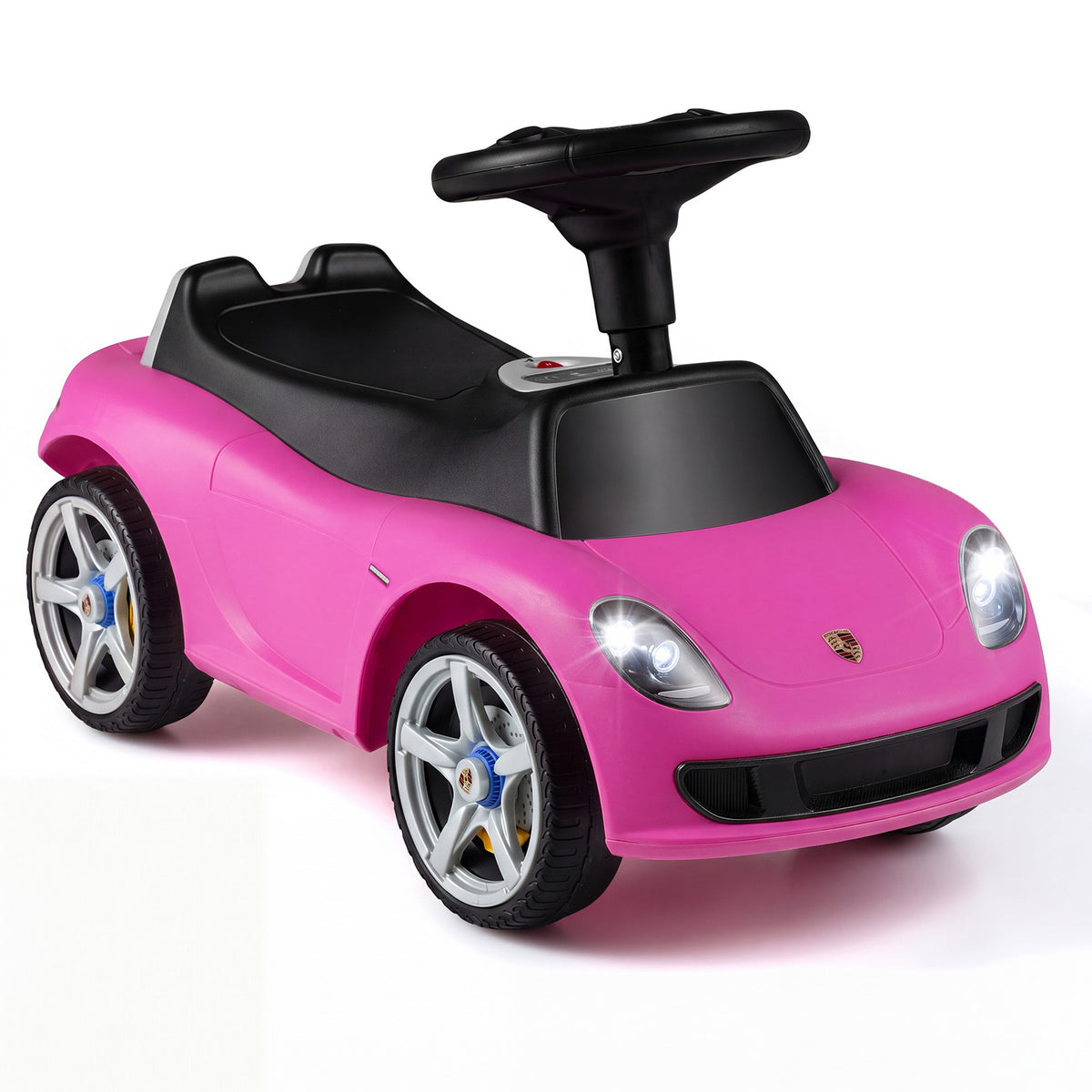 Kids Ride On Car in pink with black steering wheel and illuminated headlights on white background