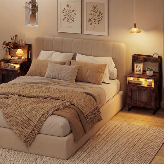 The nightstands placed on either side of a bed in a cosy bedroom with warm lighting