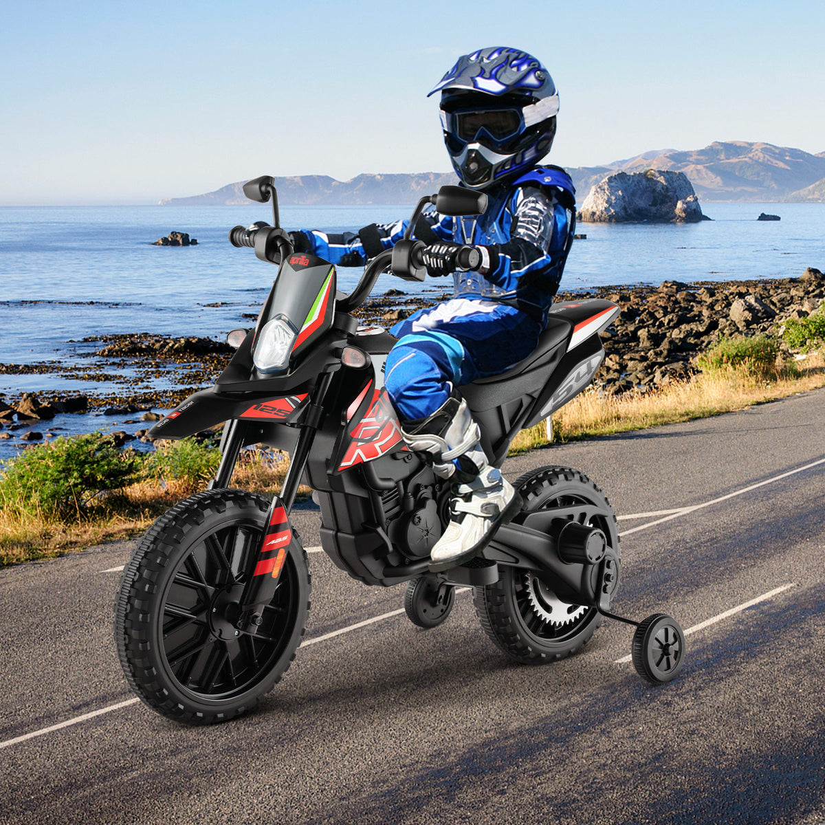 Child riding the kids electric motorbike on a coastal road