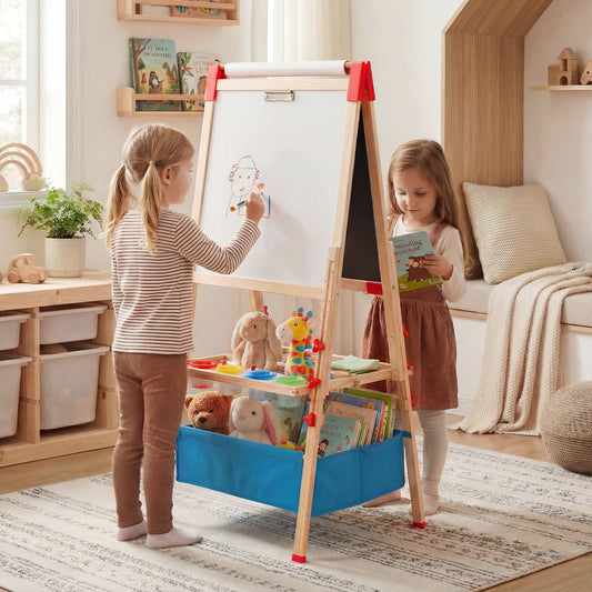 Two young children using the colourful art easel in a bright room
