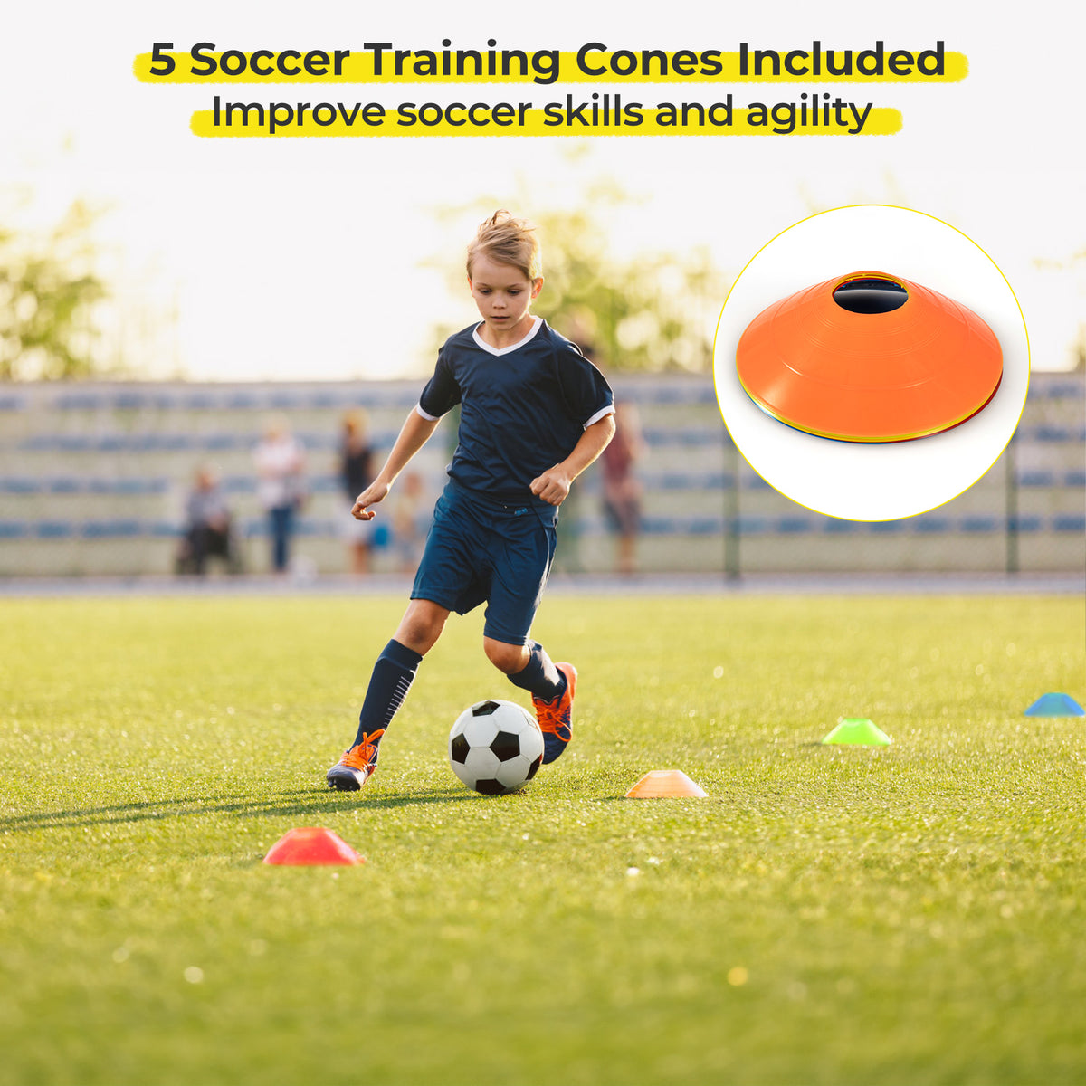 A boy dribbles a football around training cones on a sports field