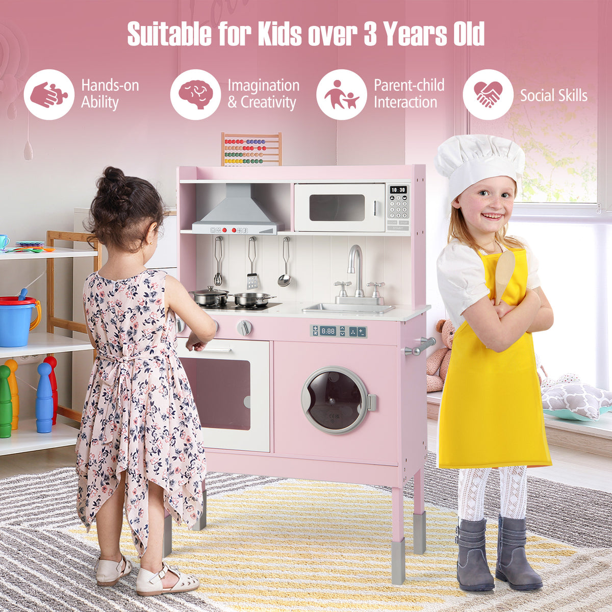 Two children interacting with the pink play kitchen set, highlighting its features