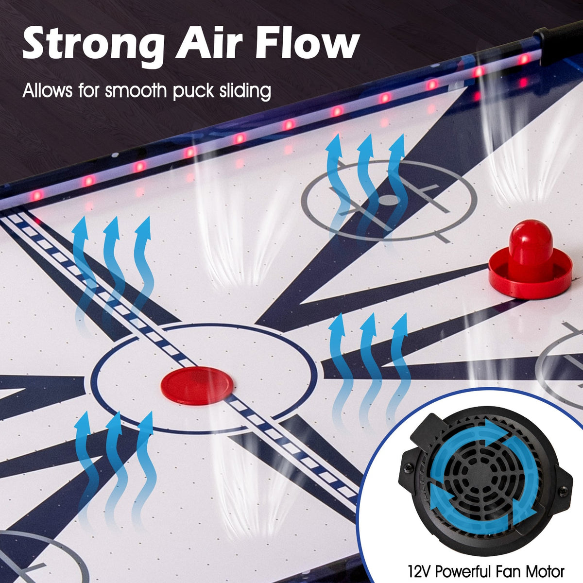 Close-up of the air hockey table surface showing air vents and a fan motor