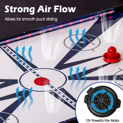 Close-up of the air hockey table surface showing air vents and a fan motor