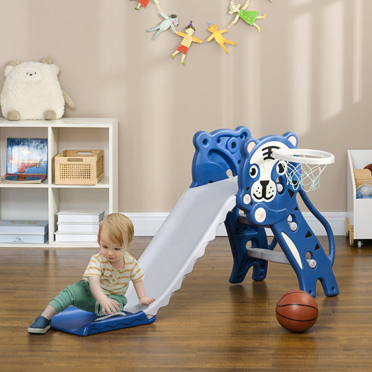 A toddler is sliding down the blue baby slide indoors