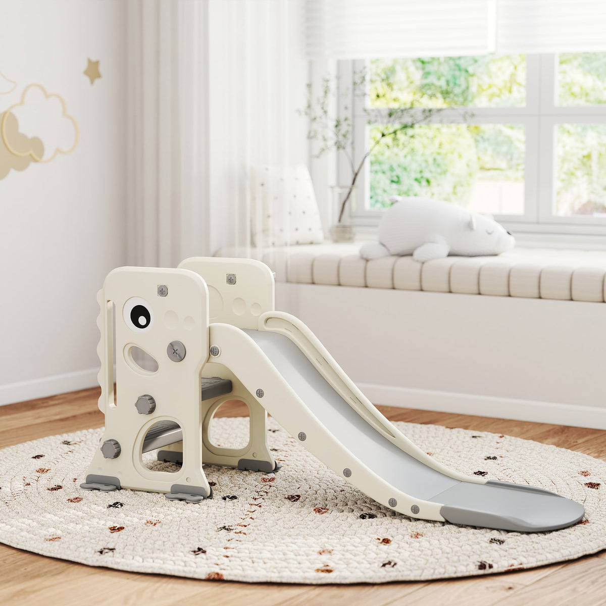 The cream white kids slide with climber is set up on a rug in a bright room
