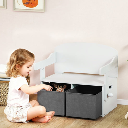 Child sitting on the floor playing with toys from the storage bench