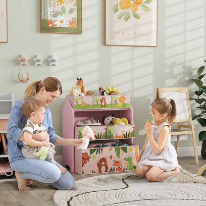 A mother and two children interacting with the pink toy storage unit in a nursery